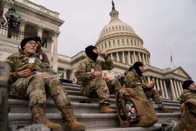 National Guard troops eat breakfast on the Capitol steps on Monday