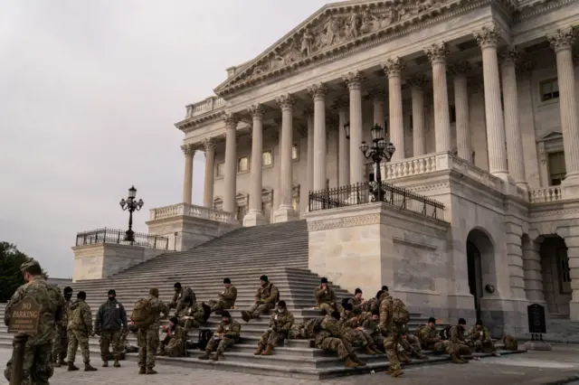 The National Guard eats on the steps of Capitol Hill