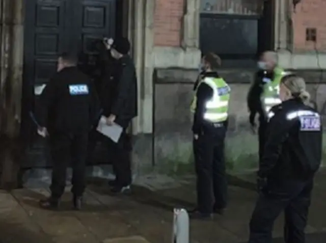 Police officers outside bar