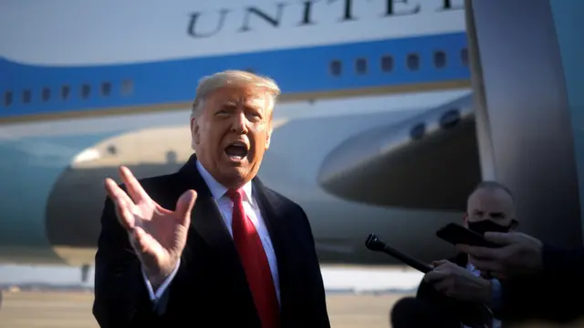 U.S. President Donald Trump speaks to the media before boarding Air Force One to depart Washington on travel to visit the U.S.-Mexico border Wall in Texas, at Joint Base Andrews in Maryland, U.S., January 12, 2021.