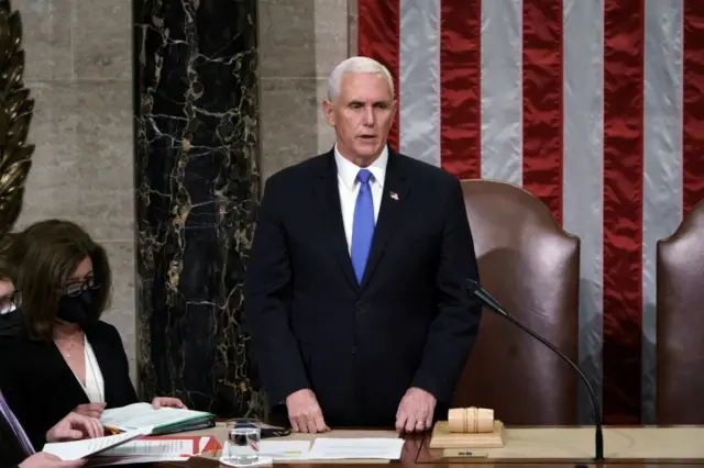 Mike Pence reads the final certification of Electoral College votes cast in November's presidential election, 7 January