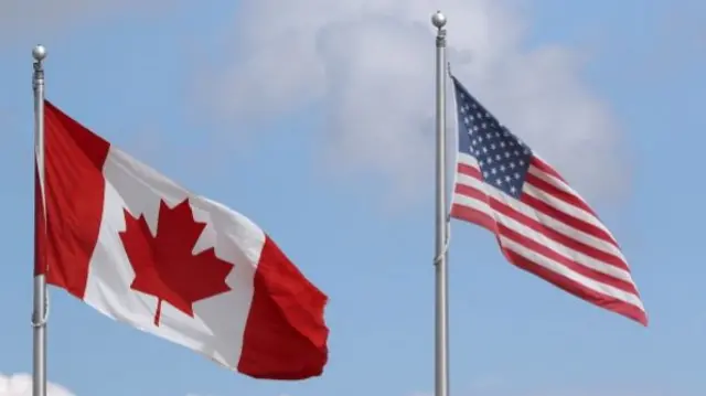 A Canadian and an American flag