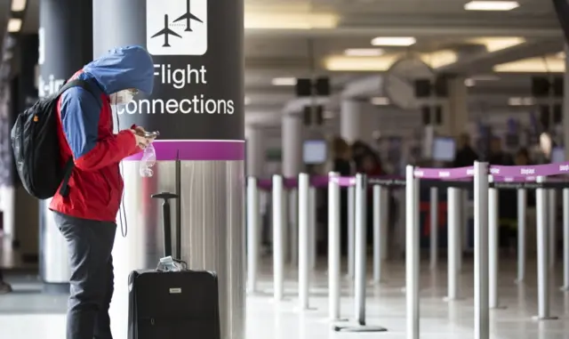 Man in mask at airport