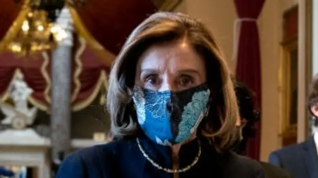 Nancy Pelosi in a mask