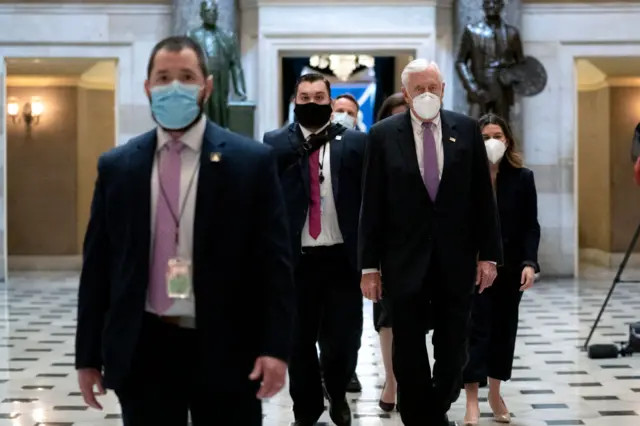 House Majority Leader Steny Hoyer (D-MD) wears a protective mask while walking to the House Floor at the U.S. Capitol on January 13, 2021 in Washington, DC