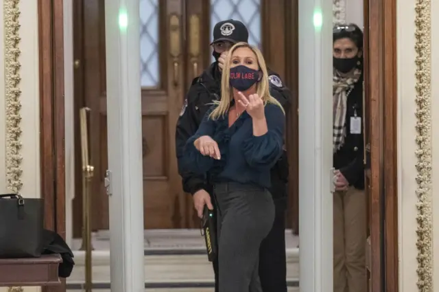 Republican representative from Georgia Marjorie Taylor Greene goes through a new security checkpoint to get on the House floor inside the US Capitol in Washington, DC, USA, 12 January 2021