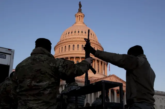 National Guard troops are issued firearms