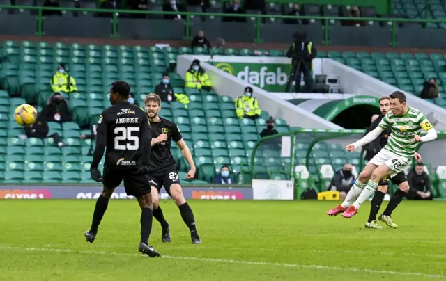 Callum McGregor lets fly with a shot for Celtic