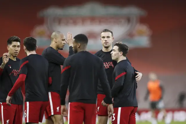 Liverpool captain Jordan Henderson with his team-mates