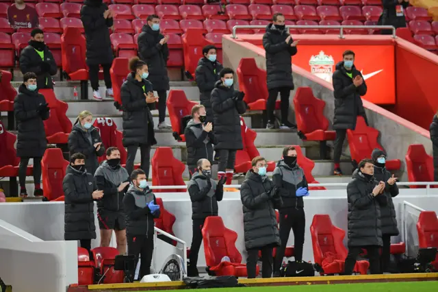 Players and staff on the Liverpool bench