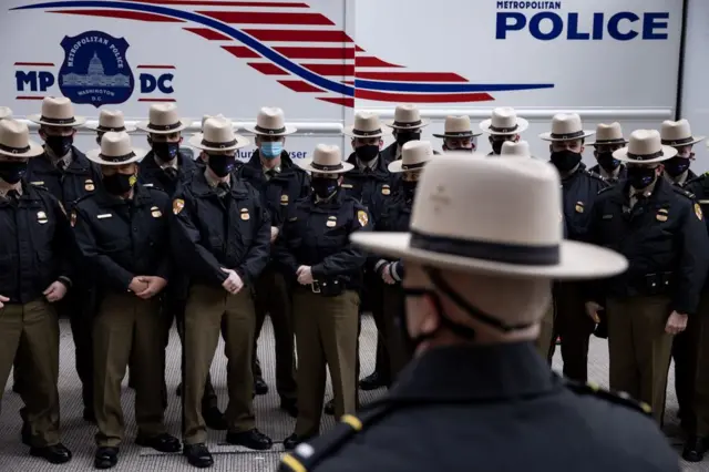 Local and out of town police forces gather near the Capitol Hill