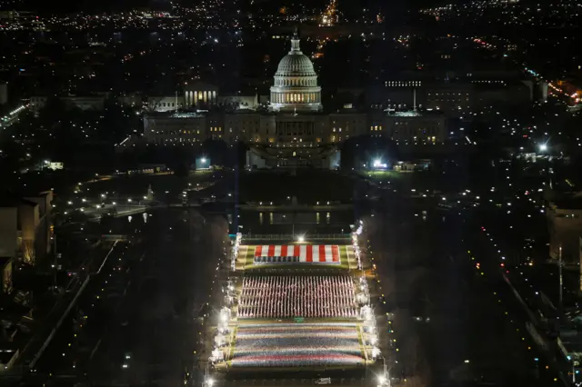 The "Field of Flags" is illuminated on the National Mall as the U.S Capitol Building is prepared for the inauguration of President-elect Joe Biden, in Washington, U.S., January 18, 2021.