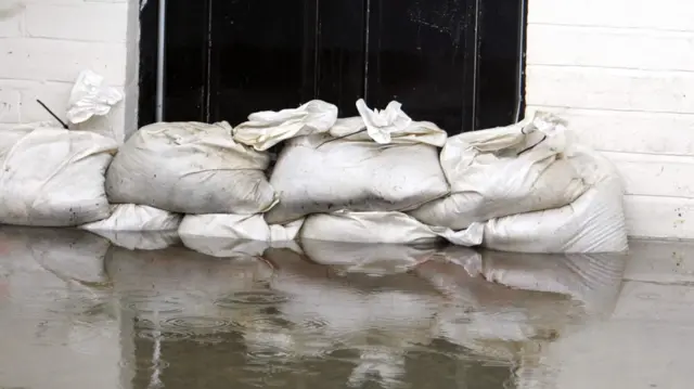 Sandbags and flood water