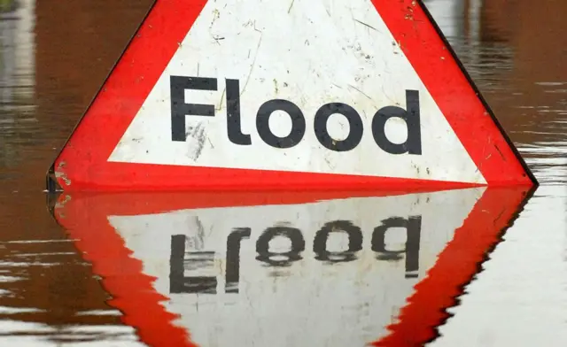 Flood sign in water