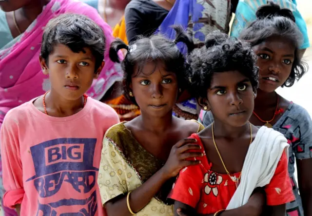 A group of children gather  at Thulasendrapuram village in Tamil Nadu, India 19 January 2021.