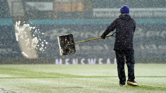 Staff clear the snow at the Hawthorns