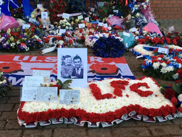 Flowers and wreaths outside Ibrox