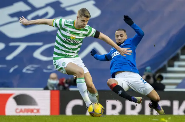 Celtic's Kristoffer Ajer holds off Rangers' Kemar Roofe