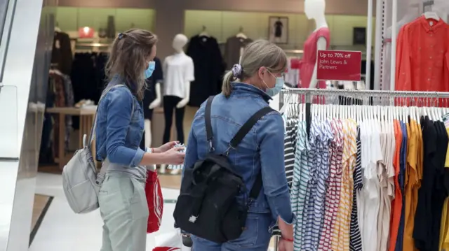 Shoppers wearing masks