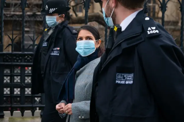 Priti Patel with police officers