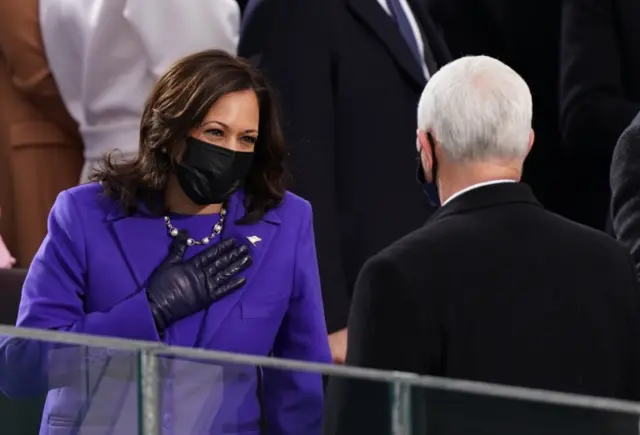 Vice President-elect Kamala Harris talks to U.S. Vice President Mike Pence as they arrive for the inauguration of Joe Biden as the 46th President of the United States