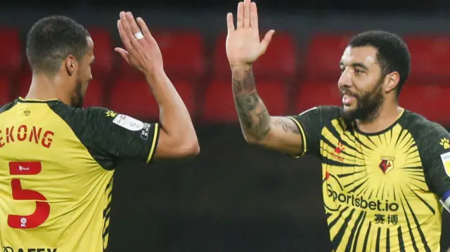 William Troost-Ekong and Troy Deeney celebrate a goal for Watford