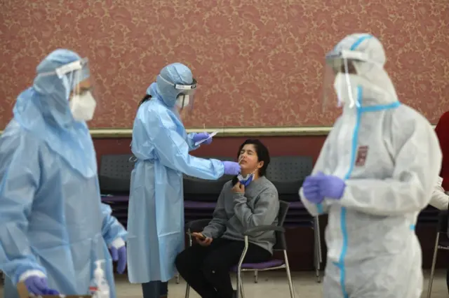 Israeli medics wearing full protective equipment collect swab samples for COVID-19 testing during a national lockdown in Ramat Gan near Tel Aviv, Israel, 20 January 2021