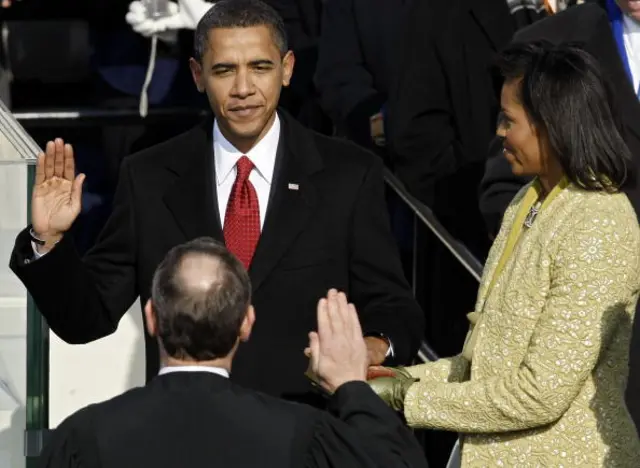 Barack H. Obama is sworn in by Chief Justice John Roberts as the 44th president of the United Statesas on the West Front of the Capitol as his wife Michelle looks on January 20, 2009 in Washington, DC