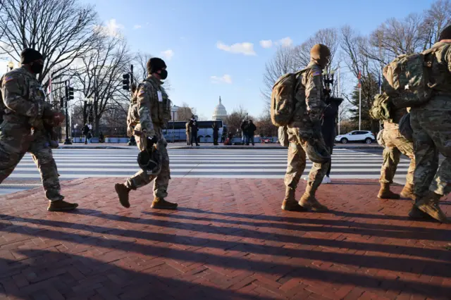 Members of the National Guard patrol the streets ahead of the inauguration