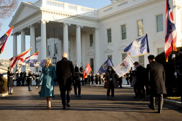 The Bidens held hands as they entered the White House grounds