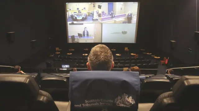 A virtual court held in a cinema