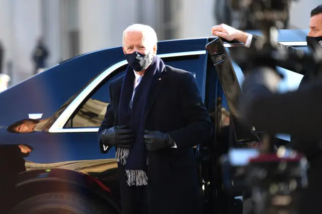 Biden emerges from car