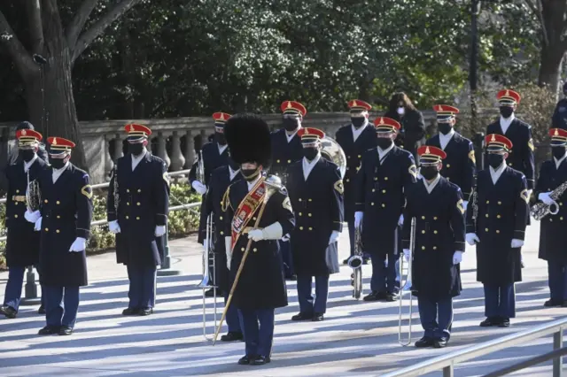 Honor Guard participate in a wreath-laying ceremony at the Tomb of the Unknown Soldier at the Arlington National Cemetery, in Arlington