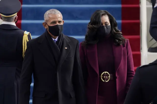 Former President Barack Obama and his wife Michelle arrive during the inauguration of Joe Biden