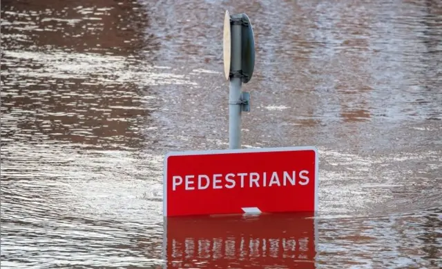 Flooded road sign