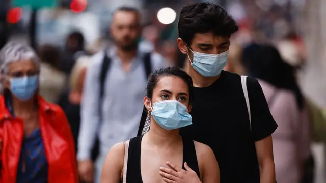 A young person wearing a mask