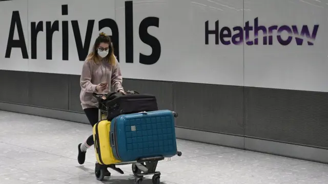 A woman arriving at Heathrow airport