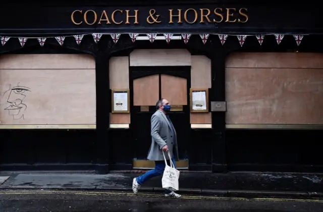 A boarded-up pub