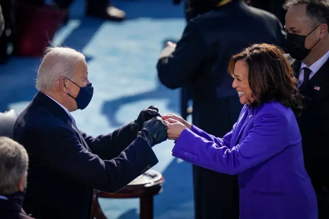 U.S. President-elect Joe Biden fist bumps newly sworn-in Vice President Kamala Harris after she took the oath of office on the West Front of the U.S. Capitol on January 20, 2021 in Washington, DC.