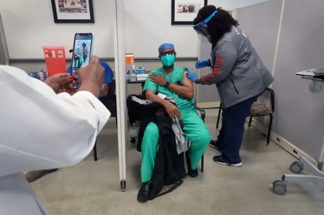 A doctor in Chicago receives his vaccine