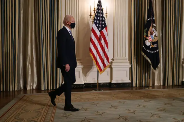 U.S. President Joe Biden arrives for a virtual swearing in ceremony for members of his new administration via Zoom just hours after his inauguration in the State Dining Room at the White House 20 January 2021 in Washington, DC.