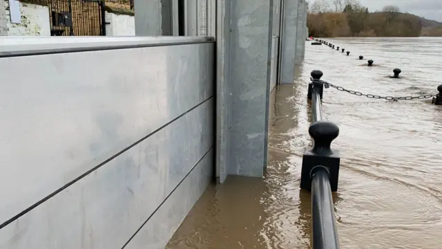 Water levels against barriers in Bewdley