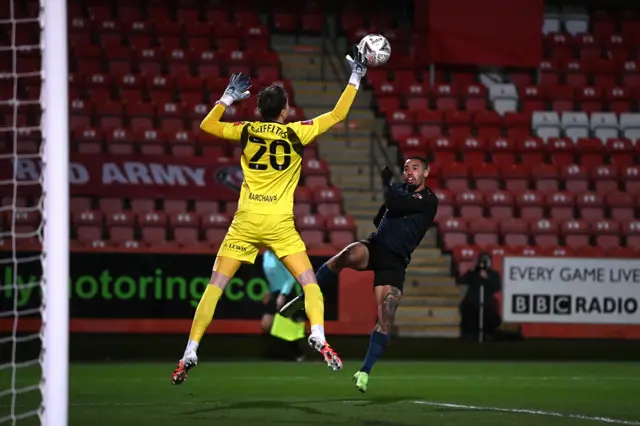 Gabriel Jesus of Manchester City has his shot saved by Josh Griffiths of Cheltenham Town during The Emirates FA Cup Fourth Round match between Cheltenham Town and Manchester City at Jonny Rocks Stadium