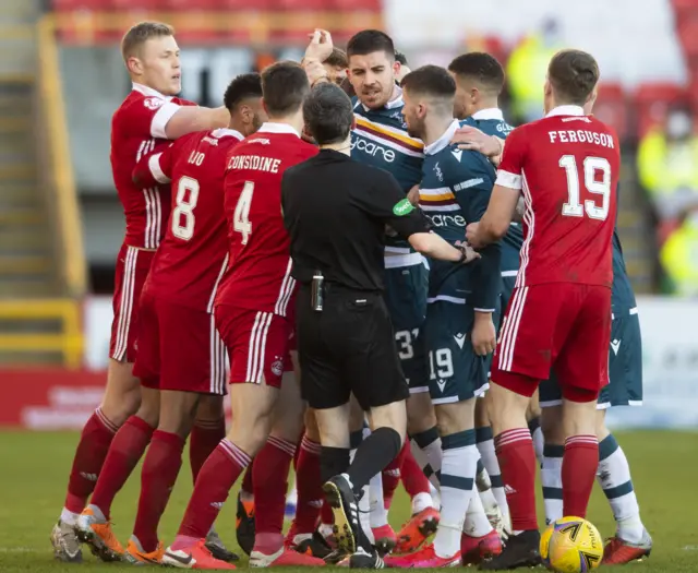 Aberdeen and Motherwell players clash