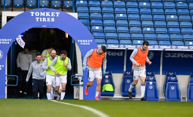 Ross County players warm-up at Ibrox