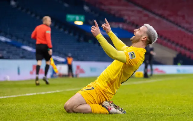 Livingston scorer Scott Robinson celebrates