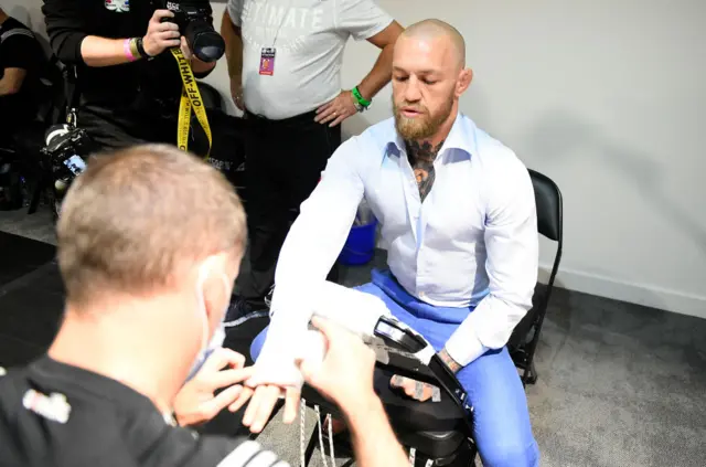 Conor McGregor getting his hands wrapped before UFC 257