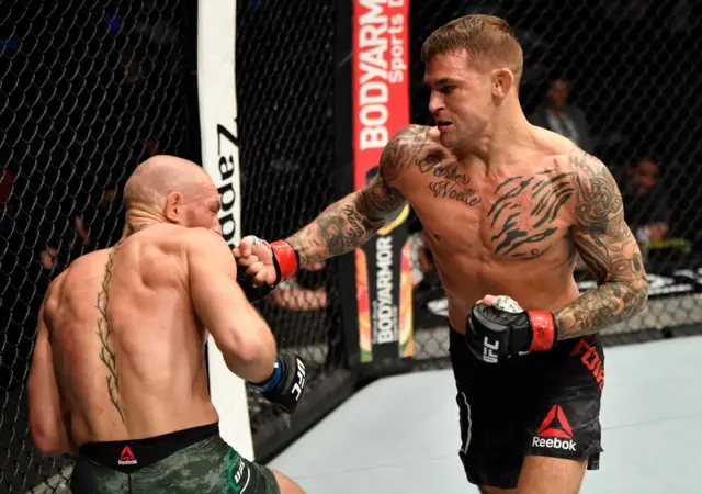 Dustin Poirier punching Conor McGregor