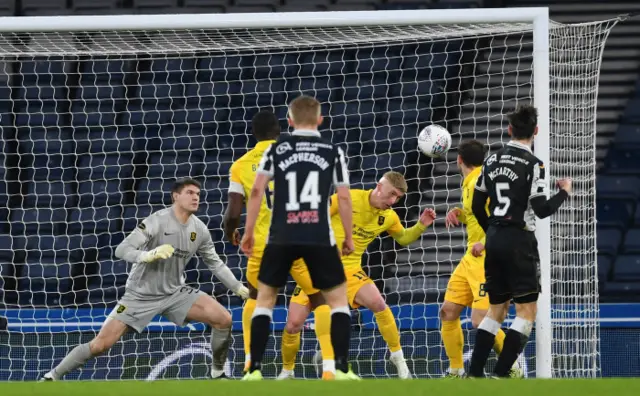 Craig Sibbald heads off the line