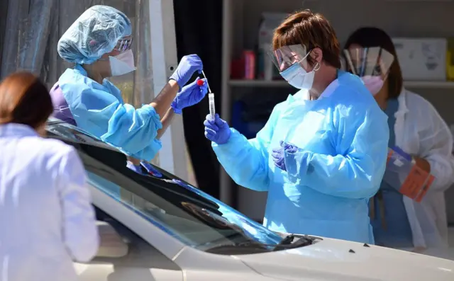 California frontline workers at a Covid drive-thru testing site